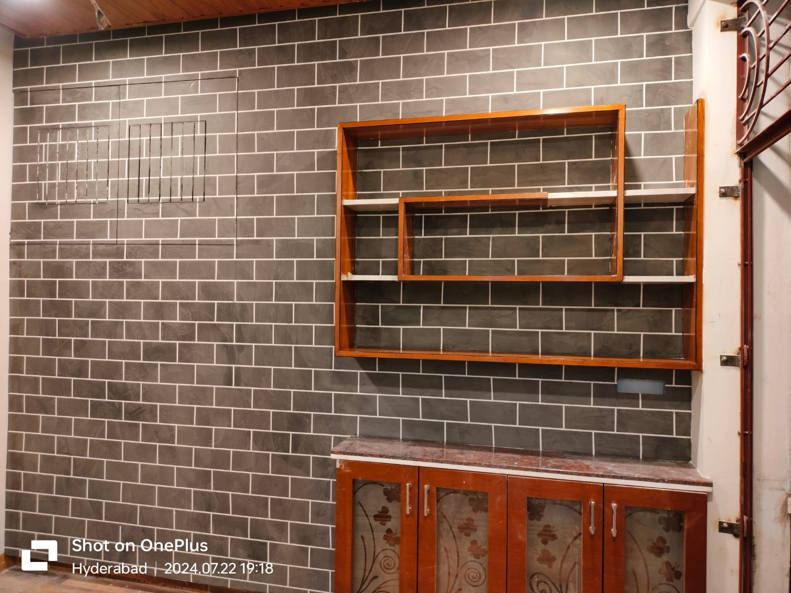 Concrete brick effect wall with shelving