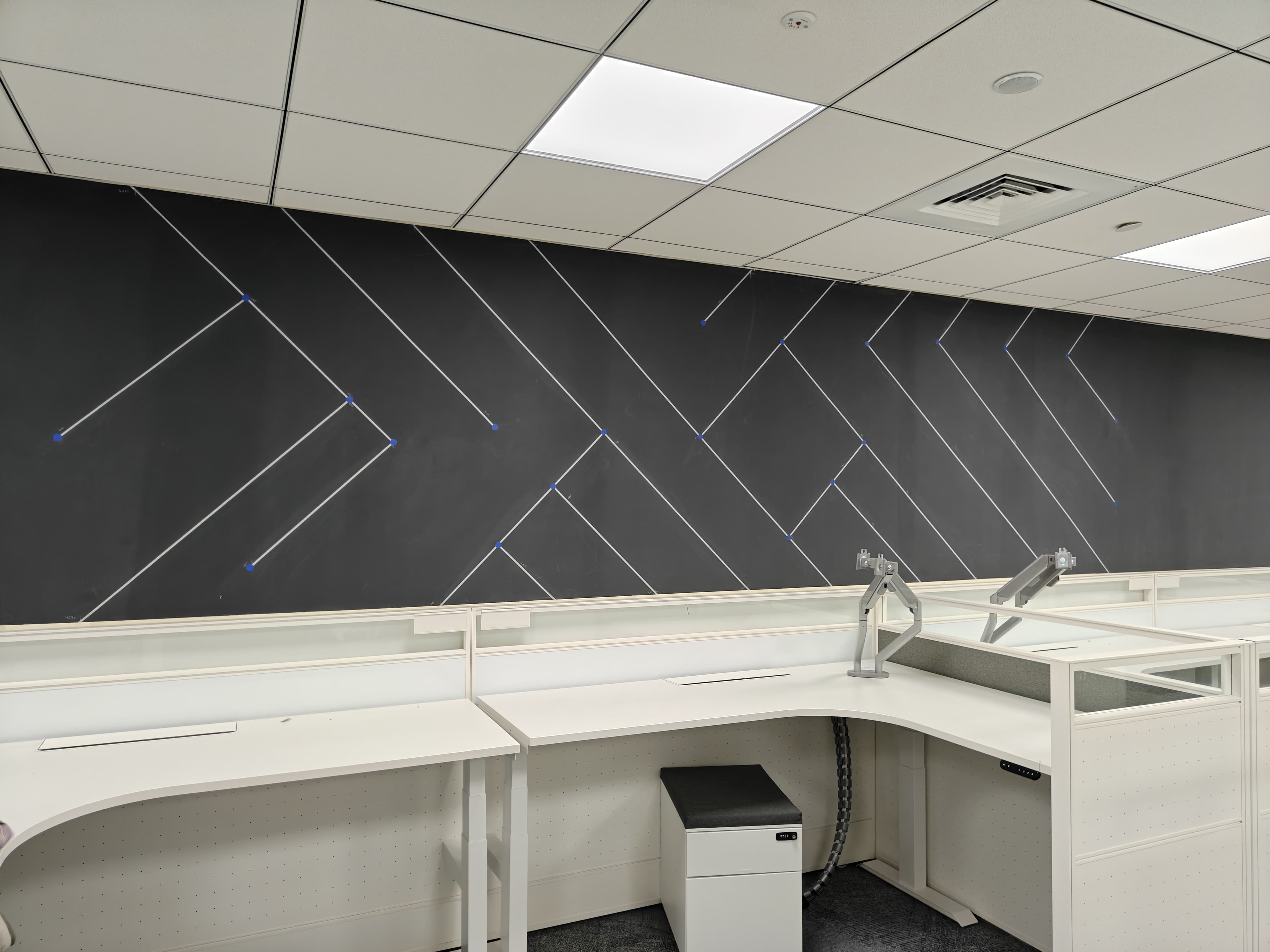 Concrete stencil geometric wall design in office